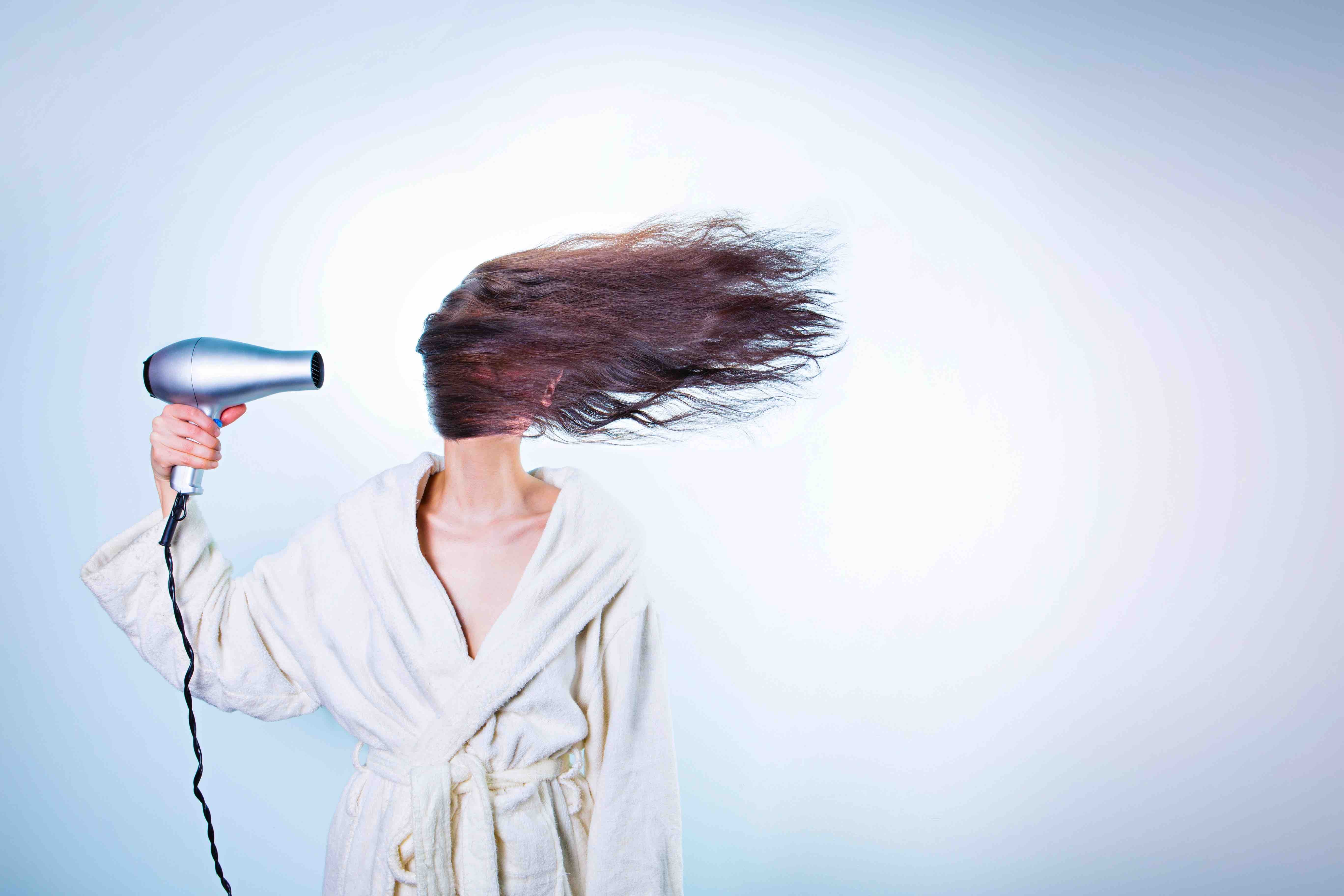 woman with a blow dryer