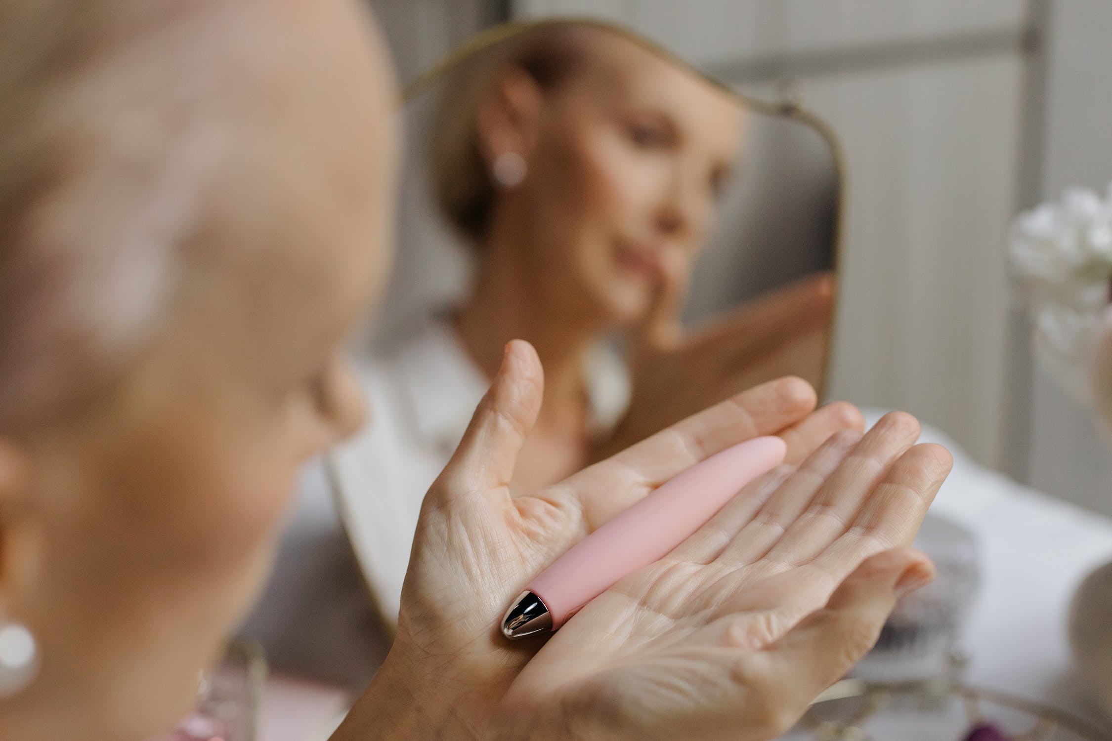 Woman holding a bullet sex toy